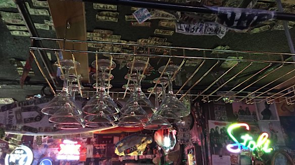 The Willow Den has dollar bills and Playboy magazine covers that line its walls.