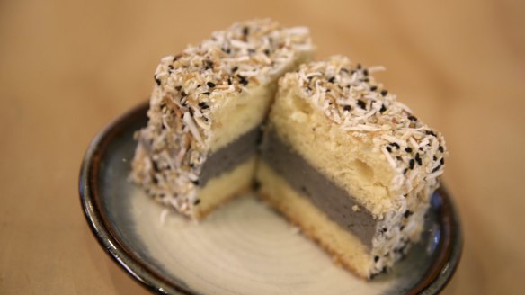 The black sesame lamington oozes a rich lava flow of black sesame cream upon slicing. 
