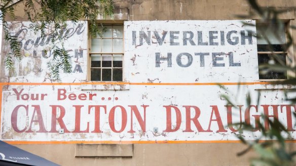 Faded beer signage on the exterior of the Inverleigh Hotel.