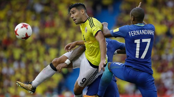 Colombia's Radamel Falcao Garcia (left) battles for the ball with Brazil's Fernandinho. Photo: AP
