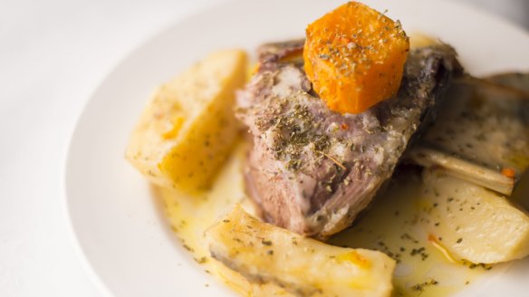 Slow-roasted lamb shoulder with baked potatoes.