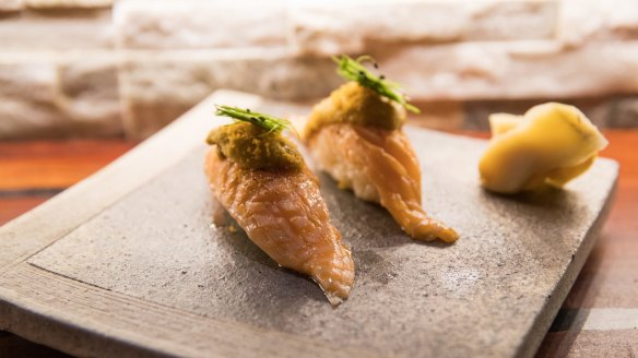 Aburi king salmon nigiri sushi with sea urchin and bottarga.