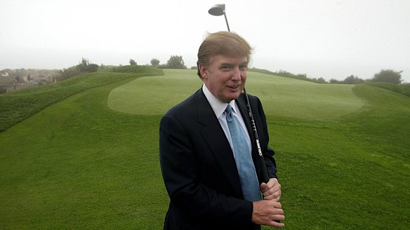 Donald Trump, pictured on one of his golf courses in 2002, has business interests around the world. 