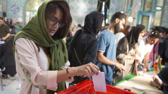 Iranians began voting Friday in the country's first presidential election since its nuclear deal with world powers.