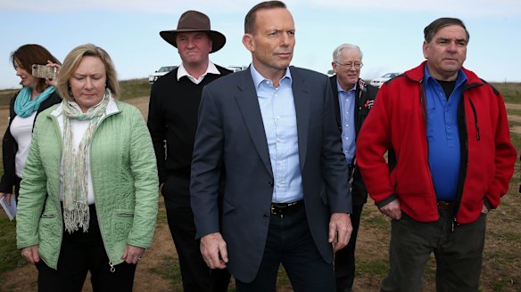 Agriculture Minister Barnaby Joyce, Prime Minister Tony Abbott and Minister for Trade and Investment, Andrew Robb at the Bellevale Homestead Cattle Yard in Yass.