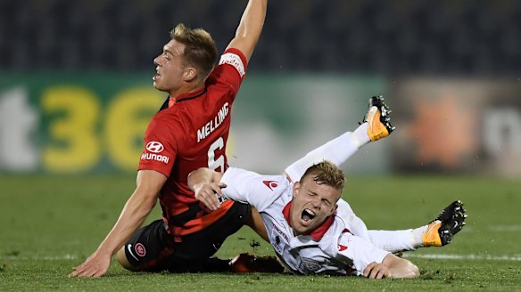 Bruising: Jacob Melling goes in hard on Jordan Elsey.