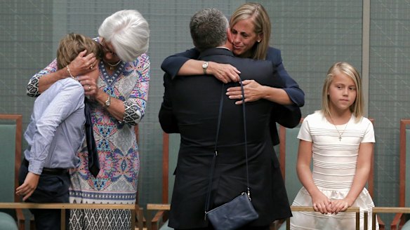 Joe Hockey embraces by his wife Melissa Babbage after his final speech to Parliament in October.