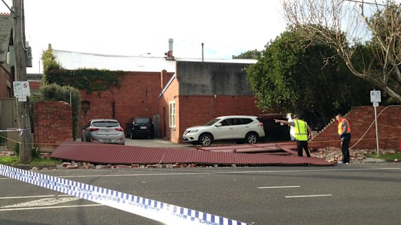 A brick wall collapsed in Flemington, closing a street.