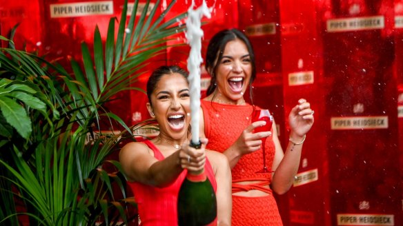 Brand ambassadors Maria Thattil (left) and Olympia Valance open the Piper-Heidsieck Champagne Bar with a bang.