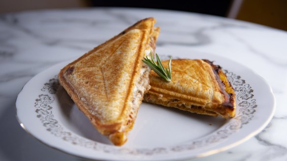 Spicy lamb jaffle, plump with slow-cooked meat, chilli tomato, and melting goat's cheese.