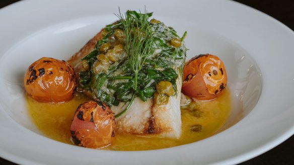 Mahi mahi with cherry tomatoes, capers and lemon beurre blanc.