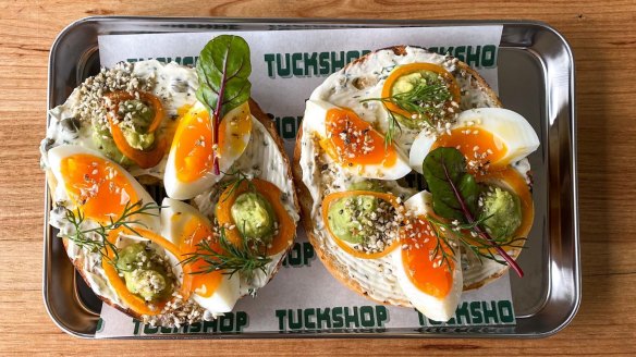 Soft-boiled egg bagel with avocado, dukkah and a caper and dill schmear at Comma Tuckshop, now open in Moorabbin.