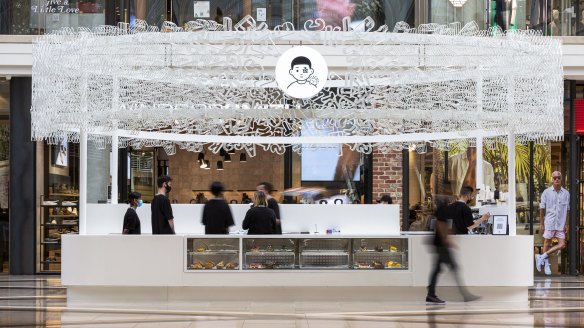 Black Star Pastry's newest store in Chadstone Shopping Centre plays on the fashion trend of "logomania" with a halo of suspended letters.