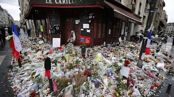 Flowers and candle tributes outside the Restaurant Le Carillon in Paris, after the November 13 attacks.