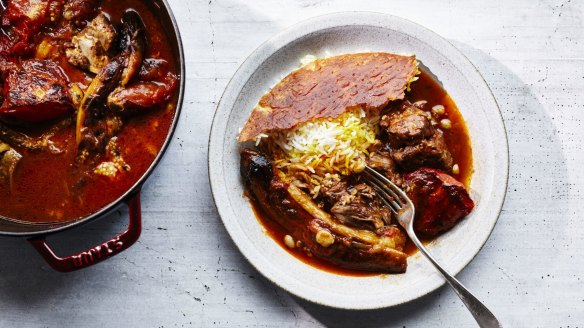 Khoresh-e bademjoon, or Iranian eggplant and tomato stew (pictured with tahdig, or Persian rice).