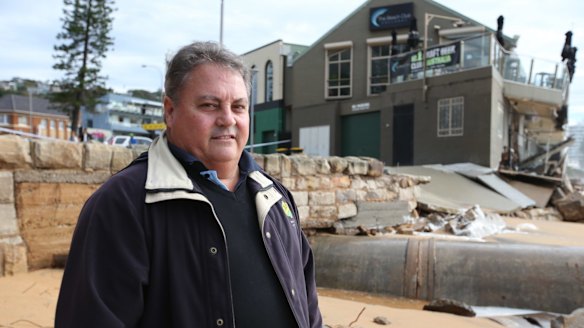 The CEO of The Beach Club hotel at Collaroy, Robert McConnell pictured with the damaged building.