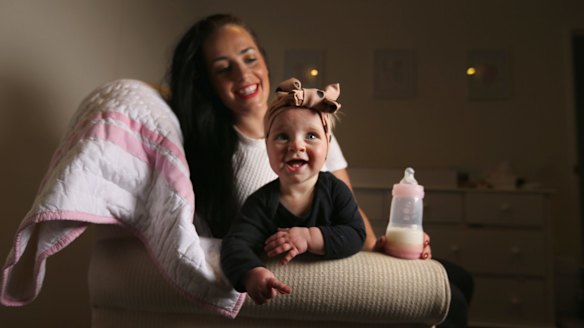 Tara Lloyd feeds her 8-month-old daughter Gracie Perkin a2 Platinum infant formula.