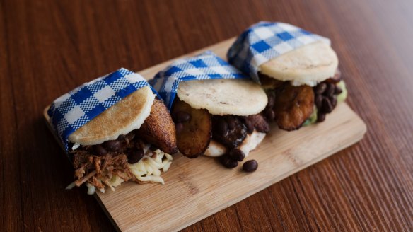 Trio of arepas from left: pabellon, domino and vegan.