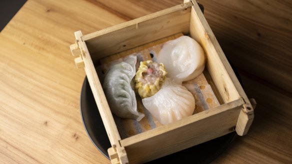 The mixed dumpling platter in a square steamer.