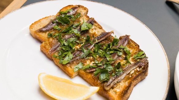 Anchovy, confit shallot and parsley on toast.
