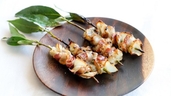 Barbecued blacklip abalone skewers with pancetta. 