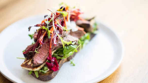 Lamb and haloumi open rye with beetroot slaw.