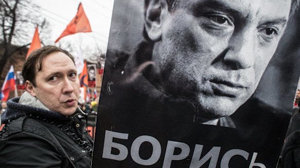 People march in memory of Russian opposition leader and former deputy prime minister Boris Nemtsov in central Moscow.   