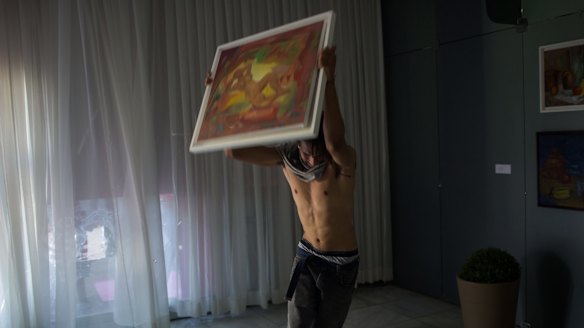 A protesters vandalises an office at the Brazilian Ministry of Agriculture on Wednesday.