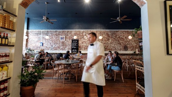 A bow-tied waiter at Laikon Deli on Bridge Road, Richmond.