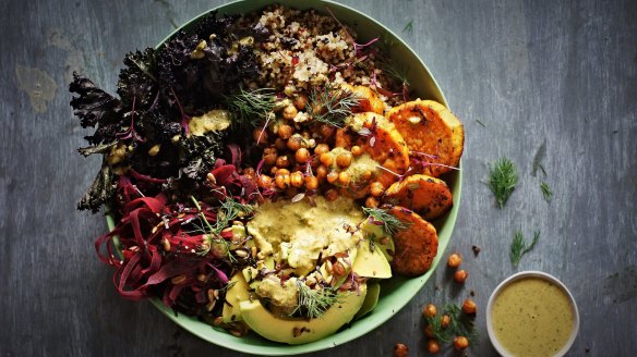 Sweet potato and kale bowl with quinoa, coriander tahini dressing and crispy chilli-lime chickpeas.