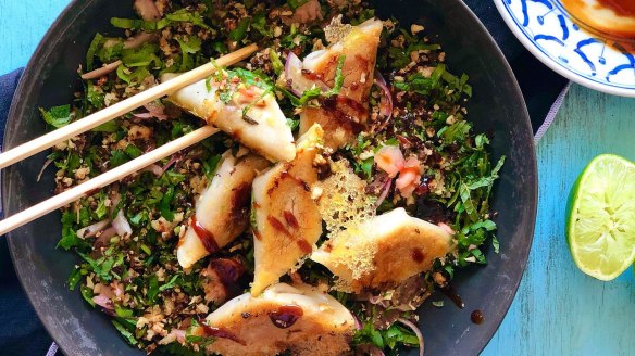 Lacy potsticker dumplings on cauliflower salad.