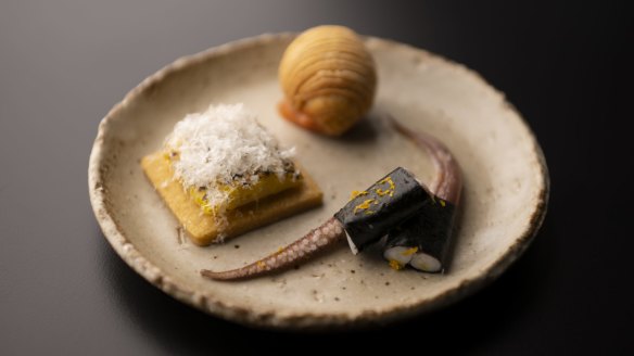 Clockwise from front right: Pickled squid wrapped in seaweed, sweet corn on shortbread with manchego cheese, puff with foie gras, celeriac and guava jam.