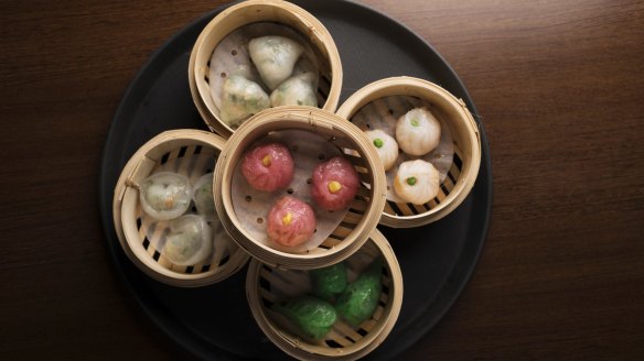 Steamed vegan dumplings of many colours.