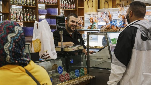 Mohammad El Basha greets customers at Chehade El Bahsa and Sons Sweets.