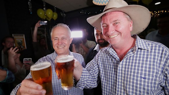 Prime Minister Malcolm Turnbull celebrates with the newly re-elected Barnaby Joyce in Tamworth.