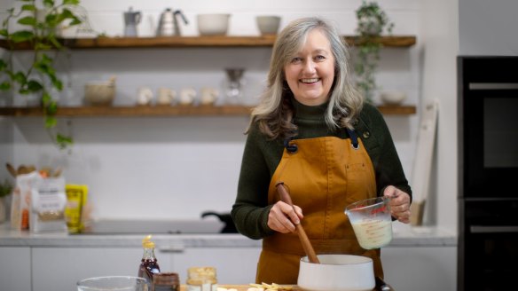 Food stylist, recipe developer and porridge fanatic Caroline Velik cooking oats in her Melbourne home kitchen.