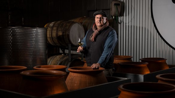 McLaren Vale winemaker Brad Hickey with the clay amphorae used to ferment zibibbo at Brash Higgins winery.