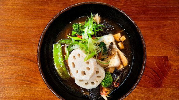 Tofu stir-fry with lotus root, snow peas and king oyster mushroom at Red Spice Road.
