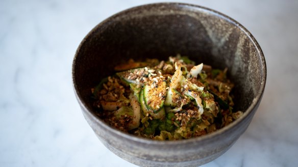 Wombok salad chockers with baby zucchini, mint and almonds.