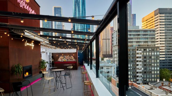 The Stolen Gem's outdoor terrace features a tiled bar, neon signage and a retractable roof.