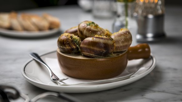 Escargot served with shells on at Bar Margaux.