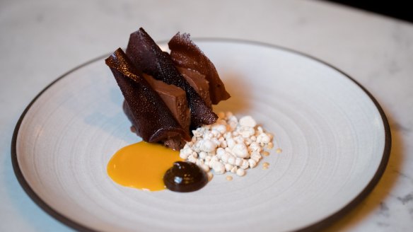 Chocolate mousse sandwiched between dark-chocolate sheets.