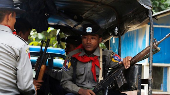 Myanmar police officers patrolling Maungdaw in Rakhine State, which neighbours  Bangladesh.