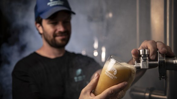 Mountain Culture owner-brewer D.J. McCready pours a rauchbier at the brewery. 