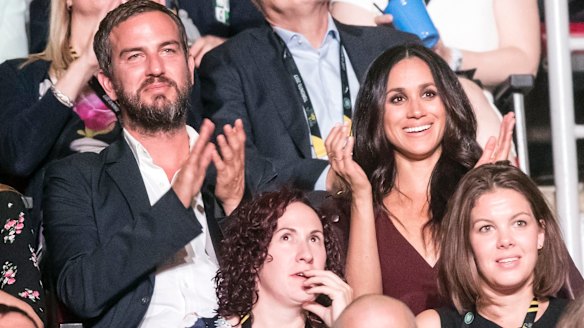 Meghan Markle sat with her friend Markus Anderson.