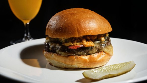 Cheeseburger with bacon and dill pickle at Rockpool Bar &amp; Grill.