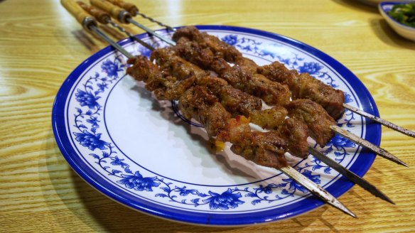Cumin-dusted charcoal-grilled lamb skewers.