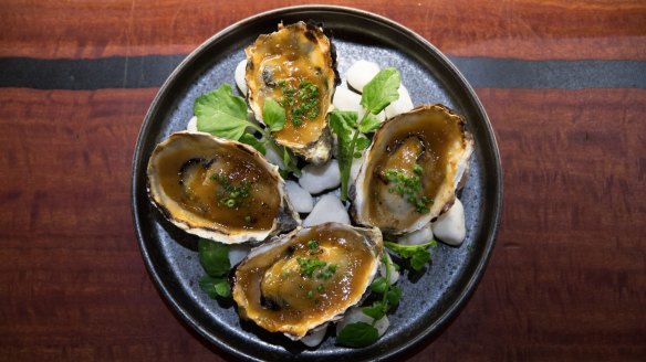 Oysters grilled in the shell and dressed with a rich yuzu miso cream.