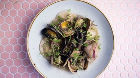 Lobster and halloumi ravioli with mussels in a rockpool of shellfish stock.