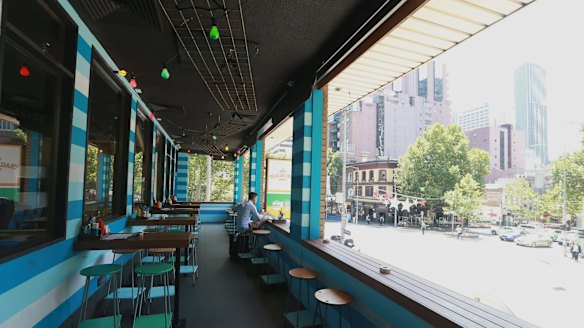 Lolling: Customers can watch the world go by from the comfort of the restaurant balcony.